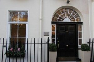 Front door of destination health travel vaccination clinic on soho square in london